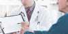 Doctor Writing on Clipboard